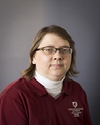 A woman wearing a crimson WSU shirt.