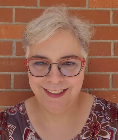 A photo of a woman smiling.