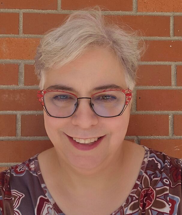 A photo of a woman smiling.