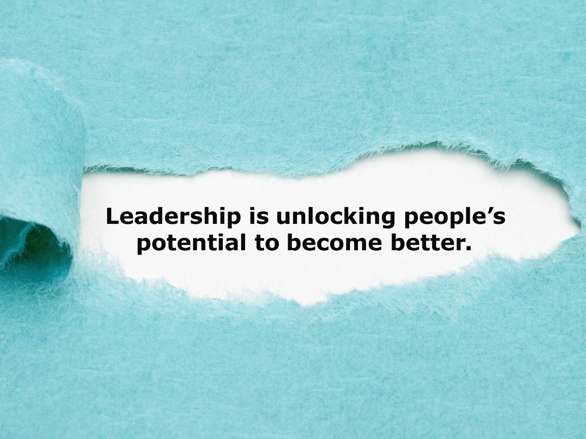 torn blue paper with a typed message about leadership.